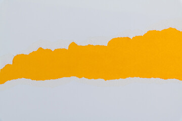 Torn paper on yellow background