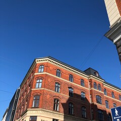 Fototapeta na wymiar red brick building with sky