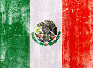Mexican flag on white concrete wall