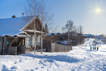 Wooden houses of ancient Ural town of Nevyansk (Ural, Russia) are buried in snowdrifts.