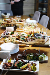 The family table is set with many dishes for the celebration of the celebration.