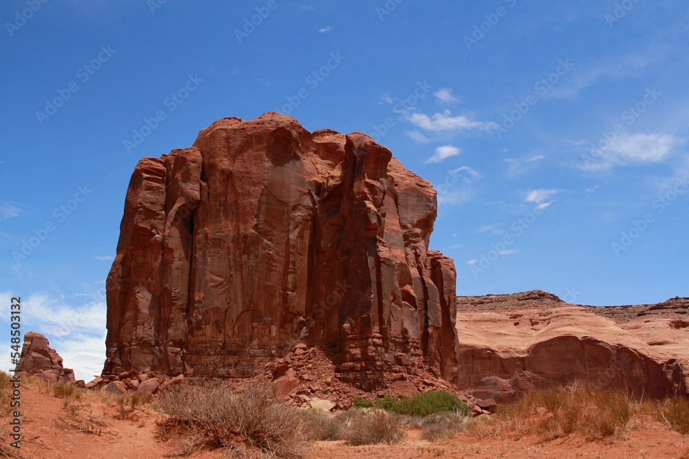 Wall mural Huge natural rock in a canyon under blue sky