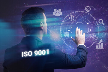 Business, technology, internet and network concept. Young businessman thinks over the steps for successful growth: ISO 9001
