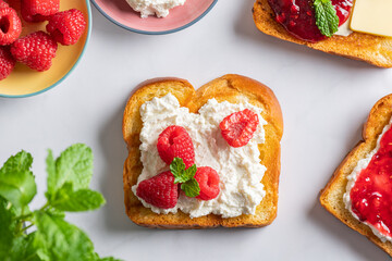Open Sandwich with Brioche bread slices, ricotta cheese, fresh raspberries and mint