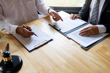 Attorneys or lawyers who are reading the statute of limitations Consultation between male lawyers...