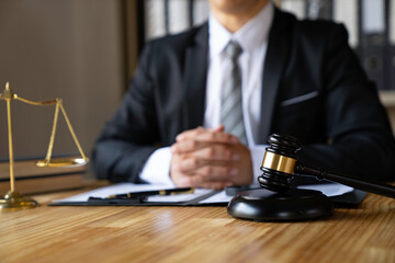 Attorney reading law code, studying constitution to protect human rights closeup, Male lawyer or judge working with Law books, gavel...