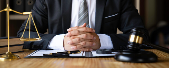 Attorney reading law code, studying constitution to protect human rights closeup, Male lawyer or judge working with Law books, gavel...
