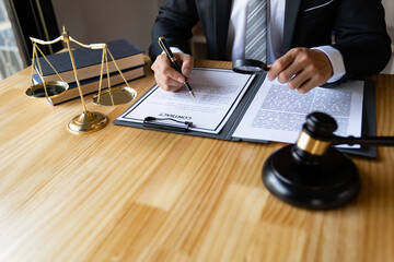 Attorney reading law code, studying constitution to protect human rights closeup, Male lawyer or judge working with Law books, gavel...