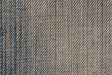 Blue jeans fabric background or denim texture. Closeup view