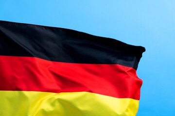Germany flag waving on blue background
