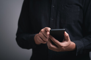 man hand holding and using smartphone, tablet, cell phone touching on screen. mobile phone application technology. copy space for text.