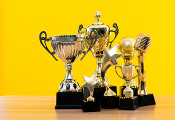 Group of trophies on wooden table