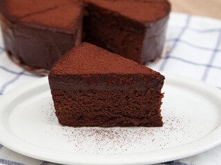 A slice of classic soft and rich chocolate cake