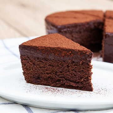 A slice of classic soft and rich chocolate cake