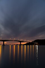 Silhouette shot of a bridge with a sunset background