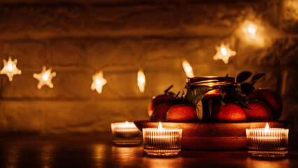 Christmas candles night evening dark background web banner. Citrus candle for festive season and...