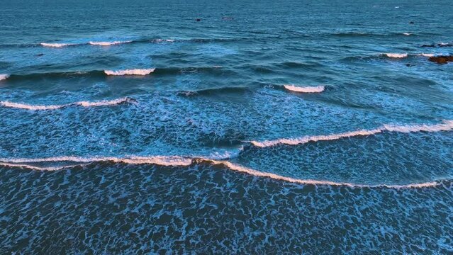 Waves at sunset on the Trengandin beach. Aerial view from a drone of the beach in the surroundings of Noja. Natural Park of the Marshes of Santo&ntilde;a, Victoria, Noja and Joyel. Cantabrian Sea. Cantabria.