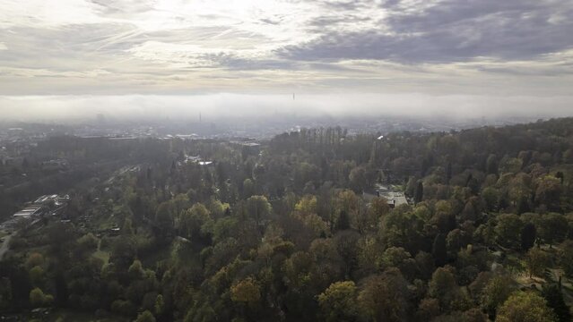 Ulm city center and minster under clouds on morning revealing aerial time lapse