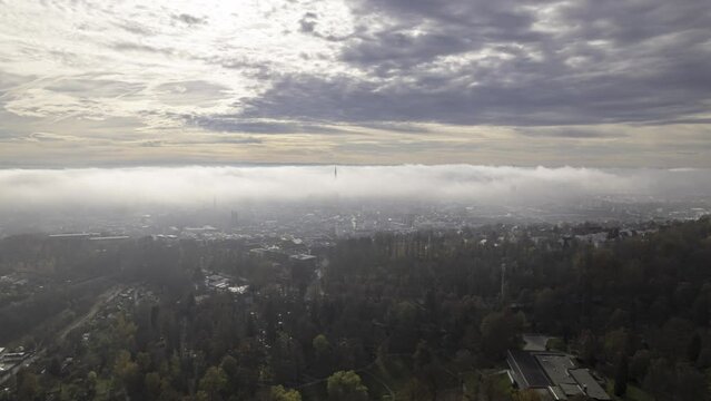 Ulm city center and minster under clouds on morning in autumn aerial time lapse