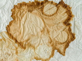 Texture of a paper towel, with coffee stain