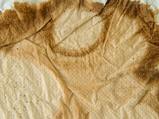 Texture of a paper towel, with coffee stain