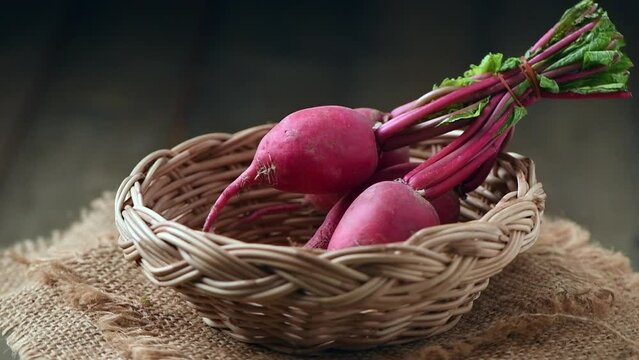 Fresh red Radish on basket, healthy food. High in calcium, phosphorus and carbohydrates It is commonly eaten fresh in salads, soups, and soups.Rotation shot and slow motion