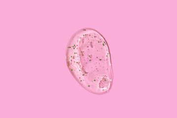 Liquid Aloe vera gel or serum on pink background
