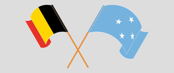 Crossed and waving flags of Belgium and Micronesia