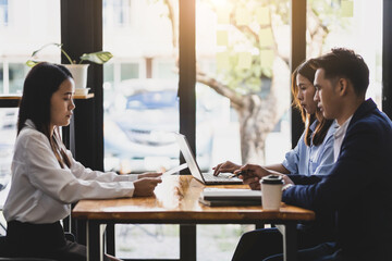 The employer or committee is interviewing and discussing the job applicant's resume. The manager is interviewing a new employee for a job. Job Search and Human Resources