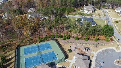 Two tennis courts in typical upscale neighborhood in Flowery Branch, suburbs Atlanta, Georgia, USA