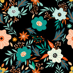 Amazing floral pattern with bright colorful flowers, plants, branches and berries on a black background. The elegant the template for fashion prints.