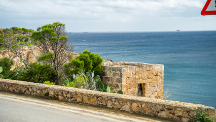 Fototapeta na wymiar ships buildings beautiful mediterranean sea malta island sand stones sun cacti