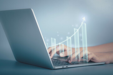 ฺBusiness growth and financial investment concept. Businessmen use laptop to analysis data...