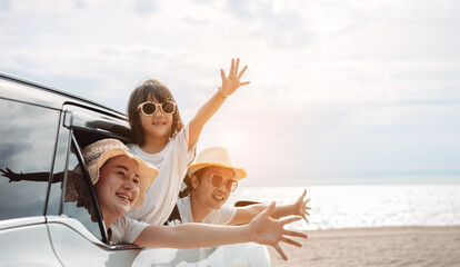 Hatchback Car travel driving road trip of family summer vacation in car at sunset,Girls happy...