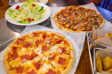  Pizza on plate on wood table with ingredients