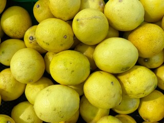 A background of fresh local lemon in a supermarket.