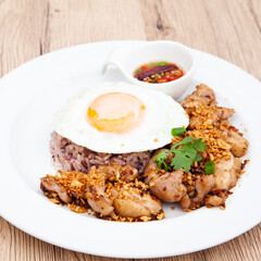 Brown rice with fried garlic chicken and fried egg, Thai healthy food
