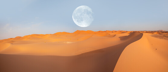 Beautiful sand dunes in the Sahara desert with full moon - Sahara, Morocco 