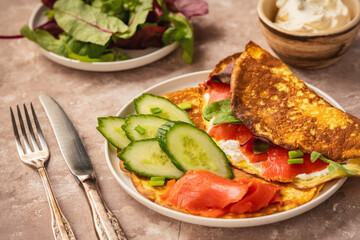 Keto lunch - keto pancakes served with ricotta and smoked salmon.