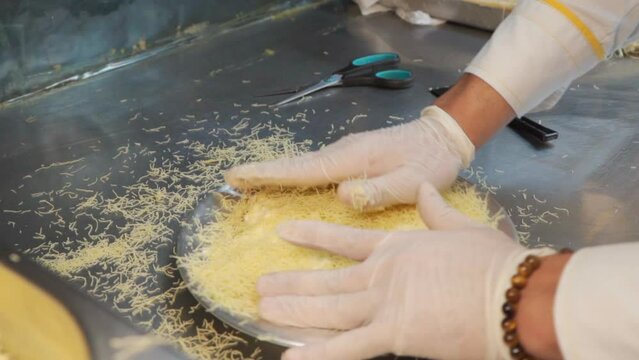 Chef make Traditional Turkish dessert kunefe and katmer