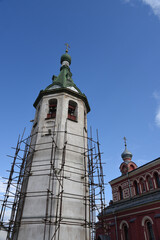 Fototapeta na wymiar Old church in the Russian city of Volkhov. Restoration is underway now.