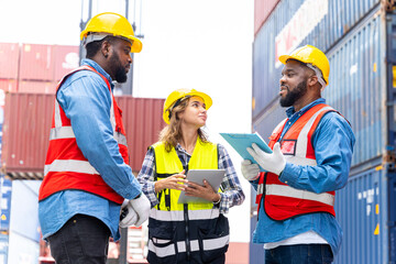 Group engineers in a container shipping company Consulting to check the order for the container that is responsible