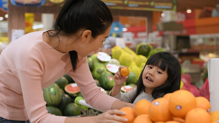 Shopping concepts of 4k Resolution. Asian women shopping for fruit in a mall.