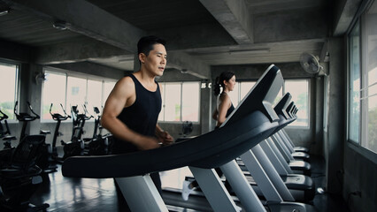 Fototapeta na wymiar Fitness concept of 4k Resolution. An athlete running on a treadmill in fitness.