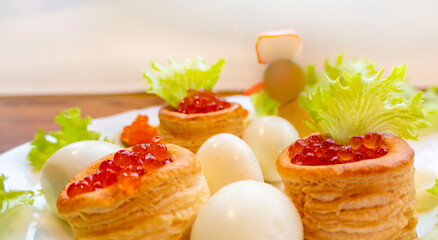 Closeup of caviar and cream cheese appetizer on crackers. High quality photo