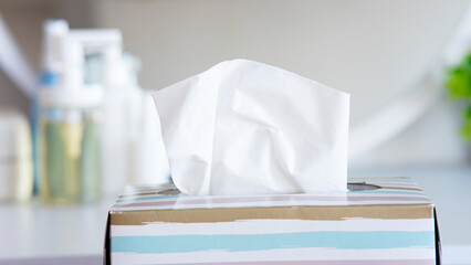 Light color napkin tissue box on white background. Cold and flu concept.