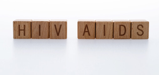 Wood blocks spelling AIDS HIV on white background