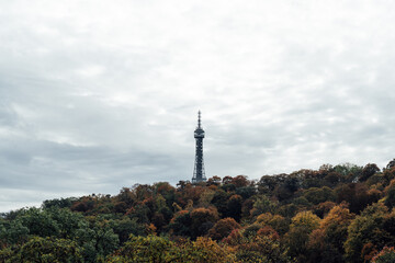 Fototapeta premium Petrin Tower in autumn scenery viewed from the hill