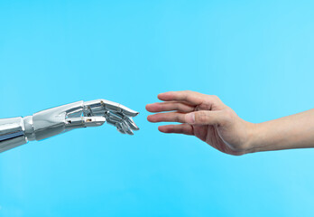 Human hand touching robot hand