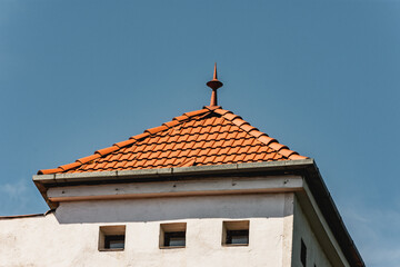 Red tiled roof of an old European building in Cluj Napoca, Romania